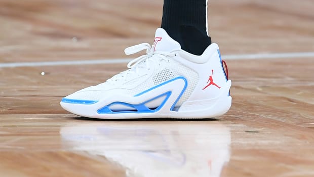 View of Jayson Tatum's white, blue, and red Jordan Brand shoe.